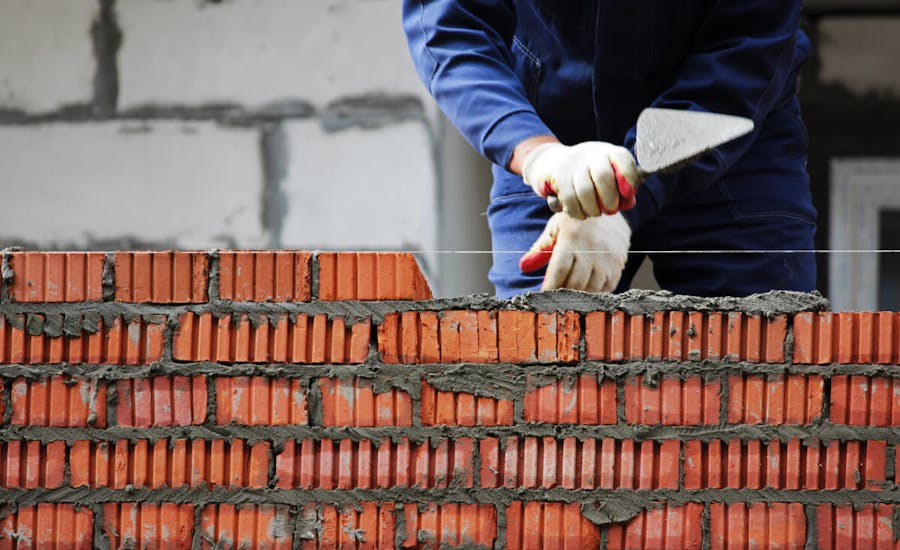 Person laying bricks