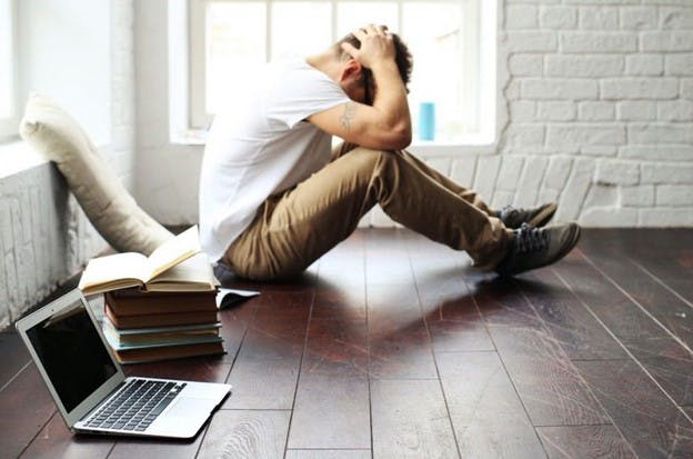 A stressed researcher considering next steps after their paper has been desk rejected